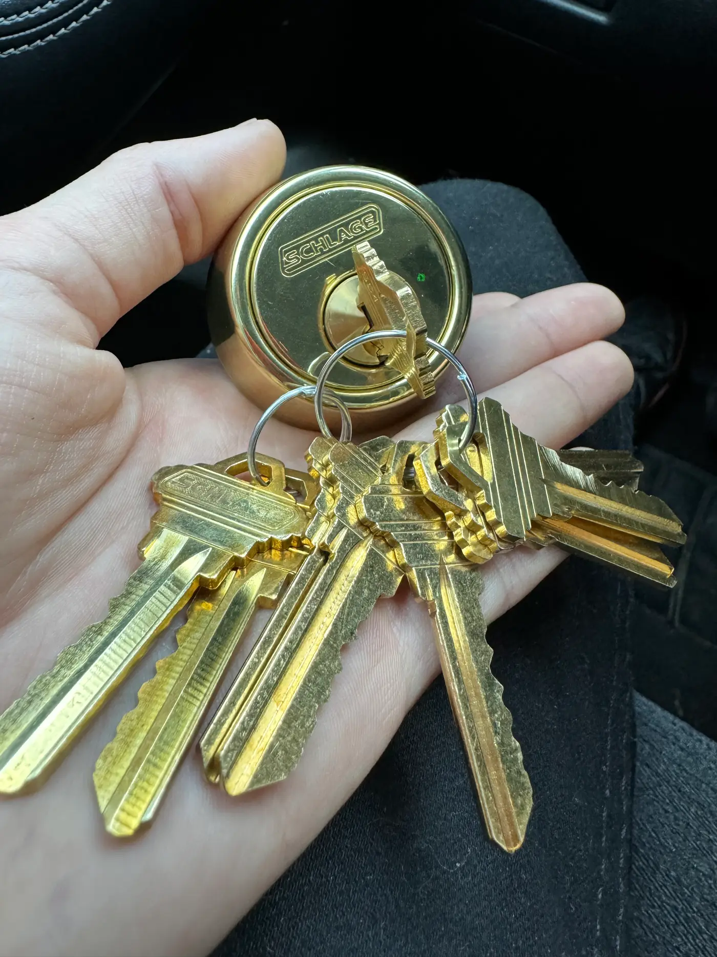 Freshly cut brass keys with a Schlage lock cylinder